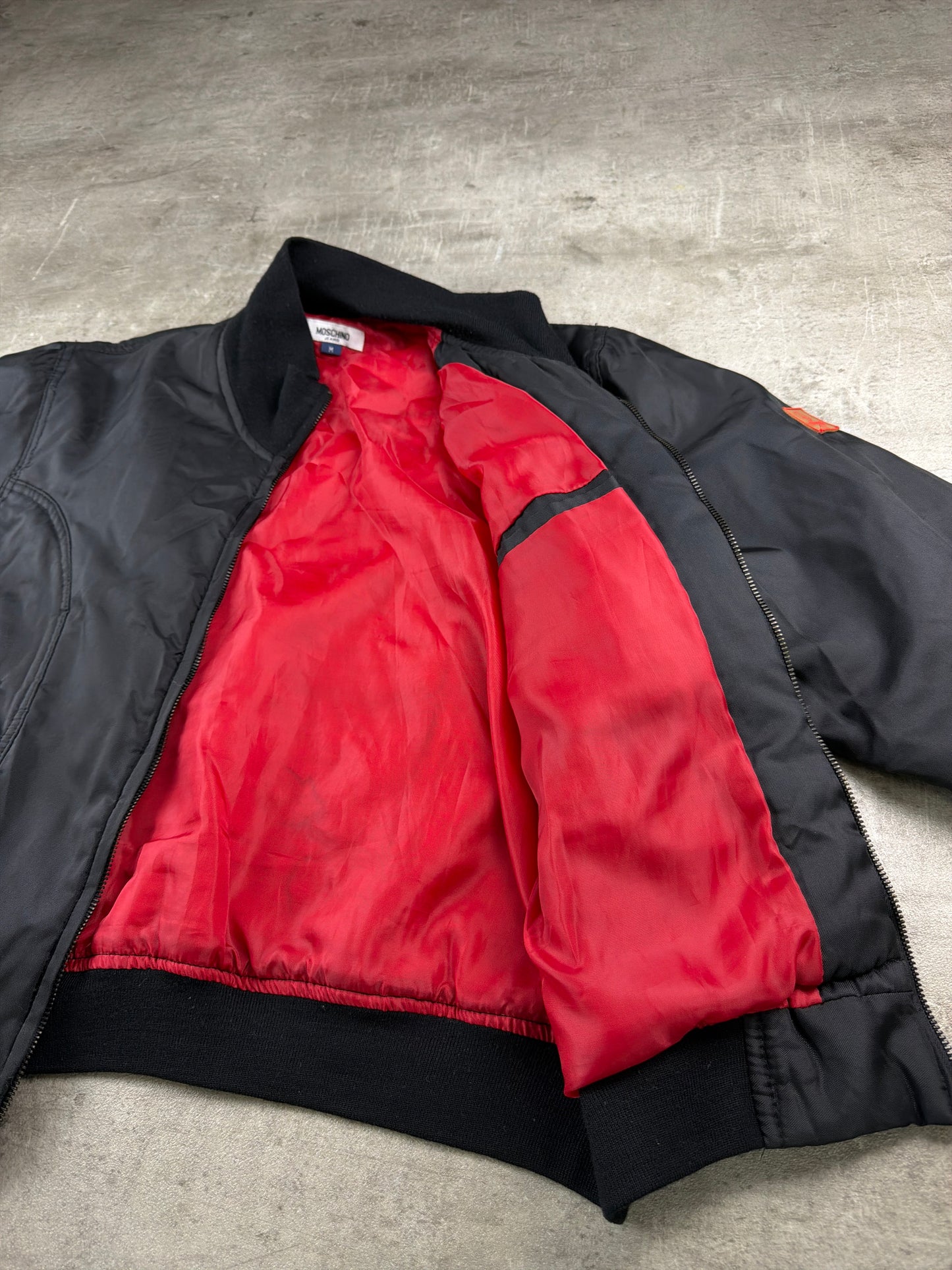 Moschino Jeans Archive Peace Patch Bomber Jacket – All Black / Red Lining